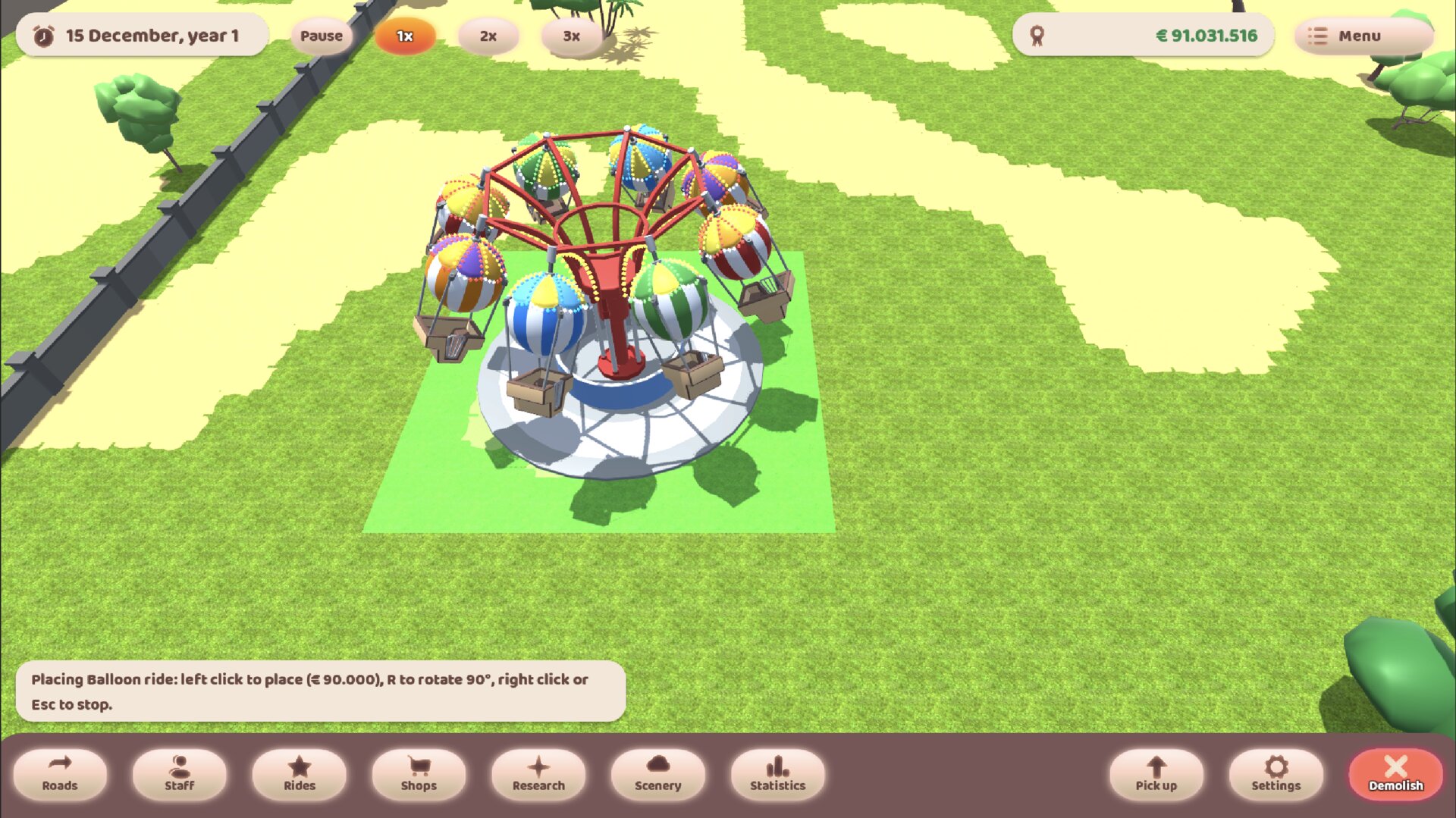 A balloon ride held over open grass on its placement footprint, with the hint bar showing what it costs and how to rotate it
